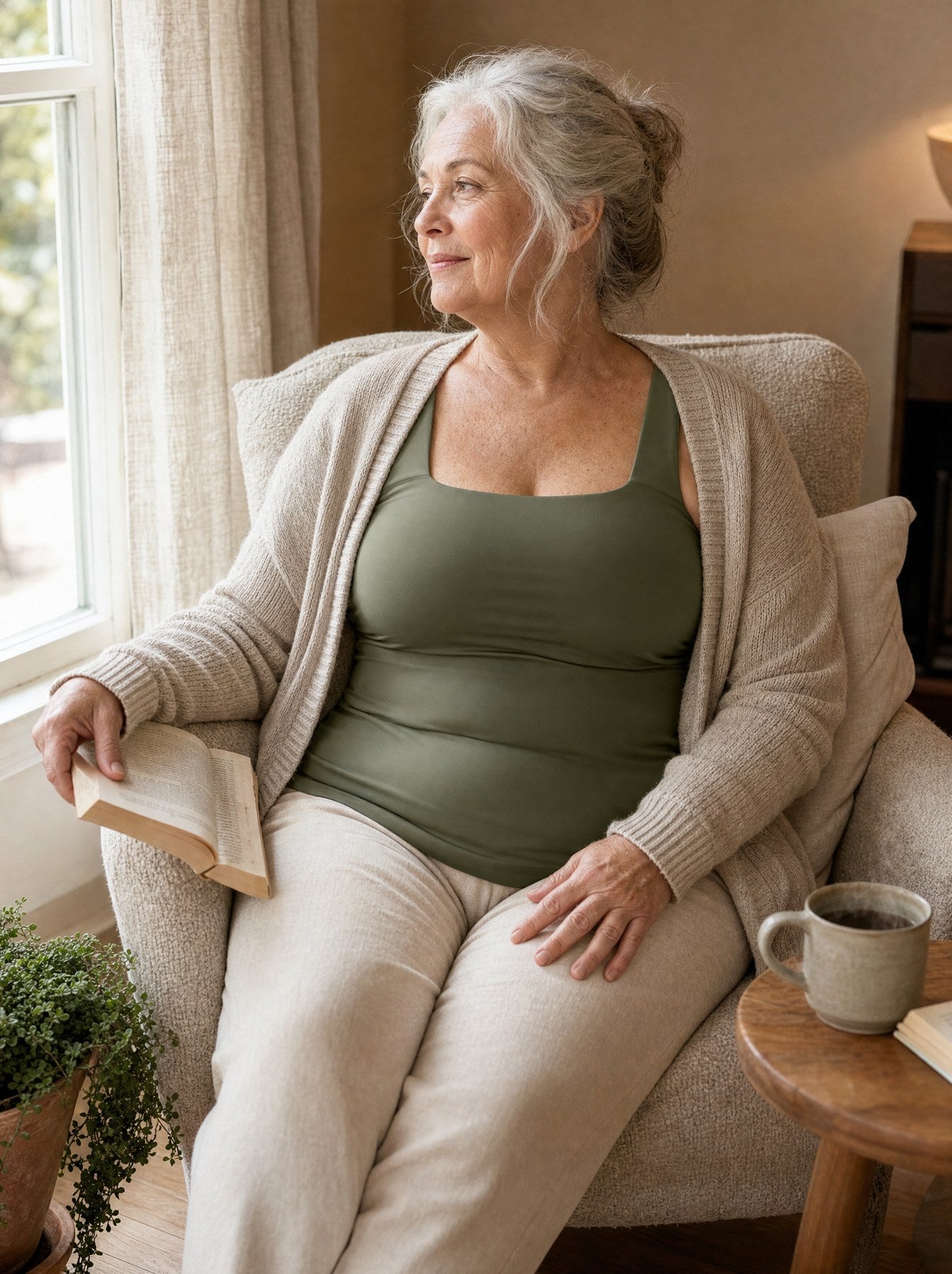 Styling illustration: older woman relaxing in a green tank with an open cardigan